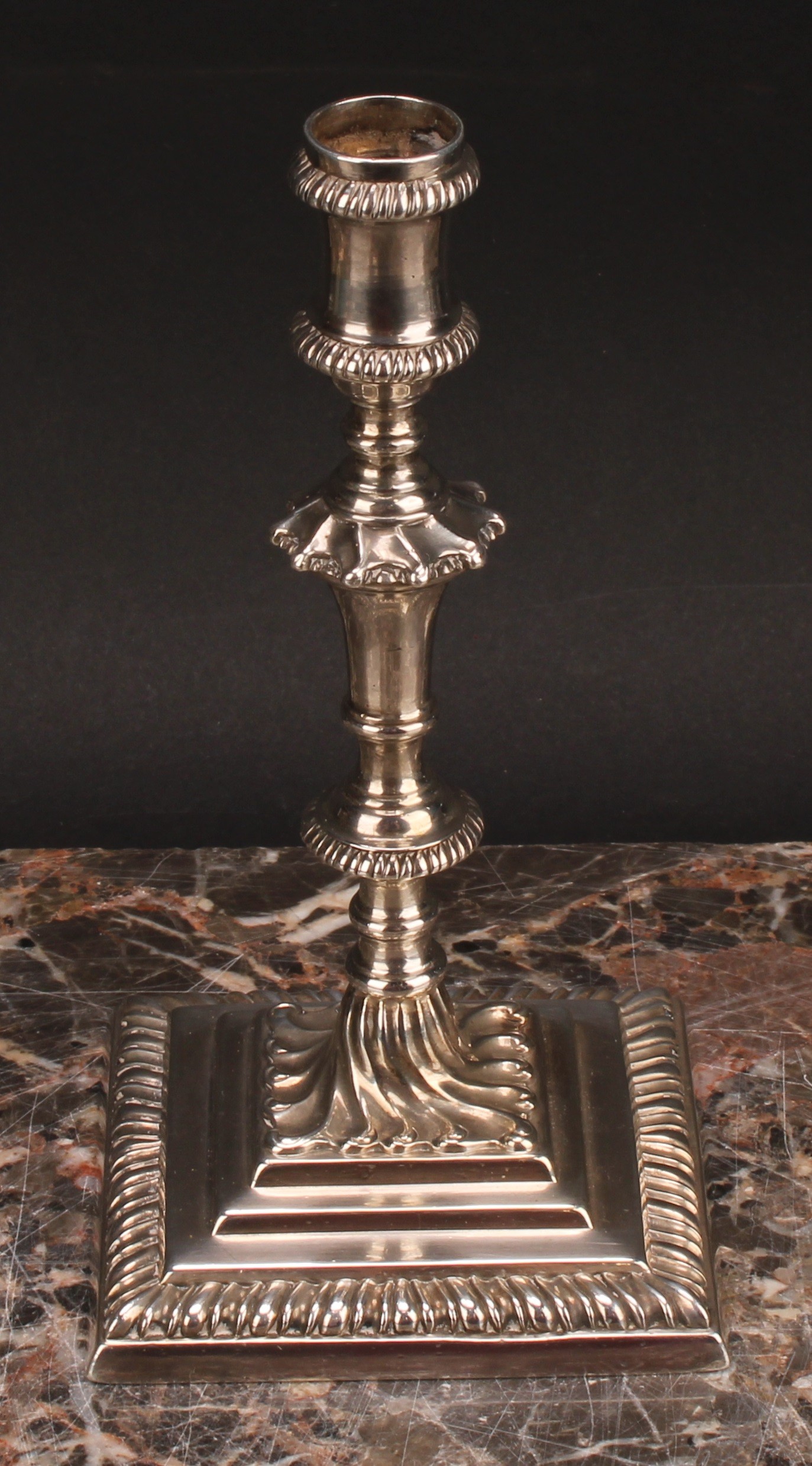 An early George III cast silver taperstick, knopped pillar, stepped square base with gadrooned - Image 2 of 4