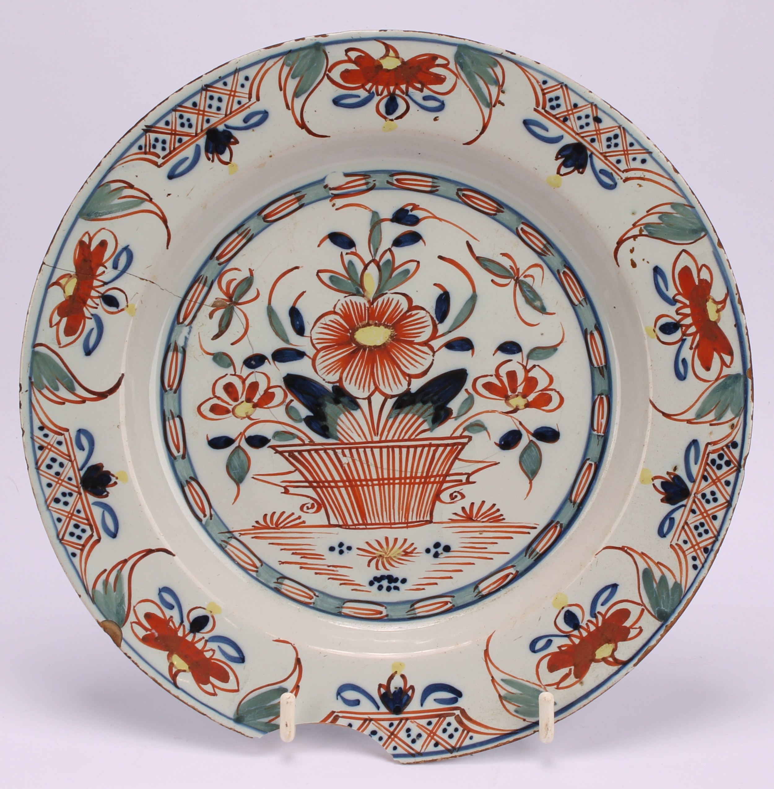 An 18th century Delft circular plate, painted in the chinoiserie taste with a figure in a Chinese - Image 12 of 18