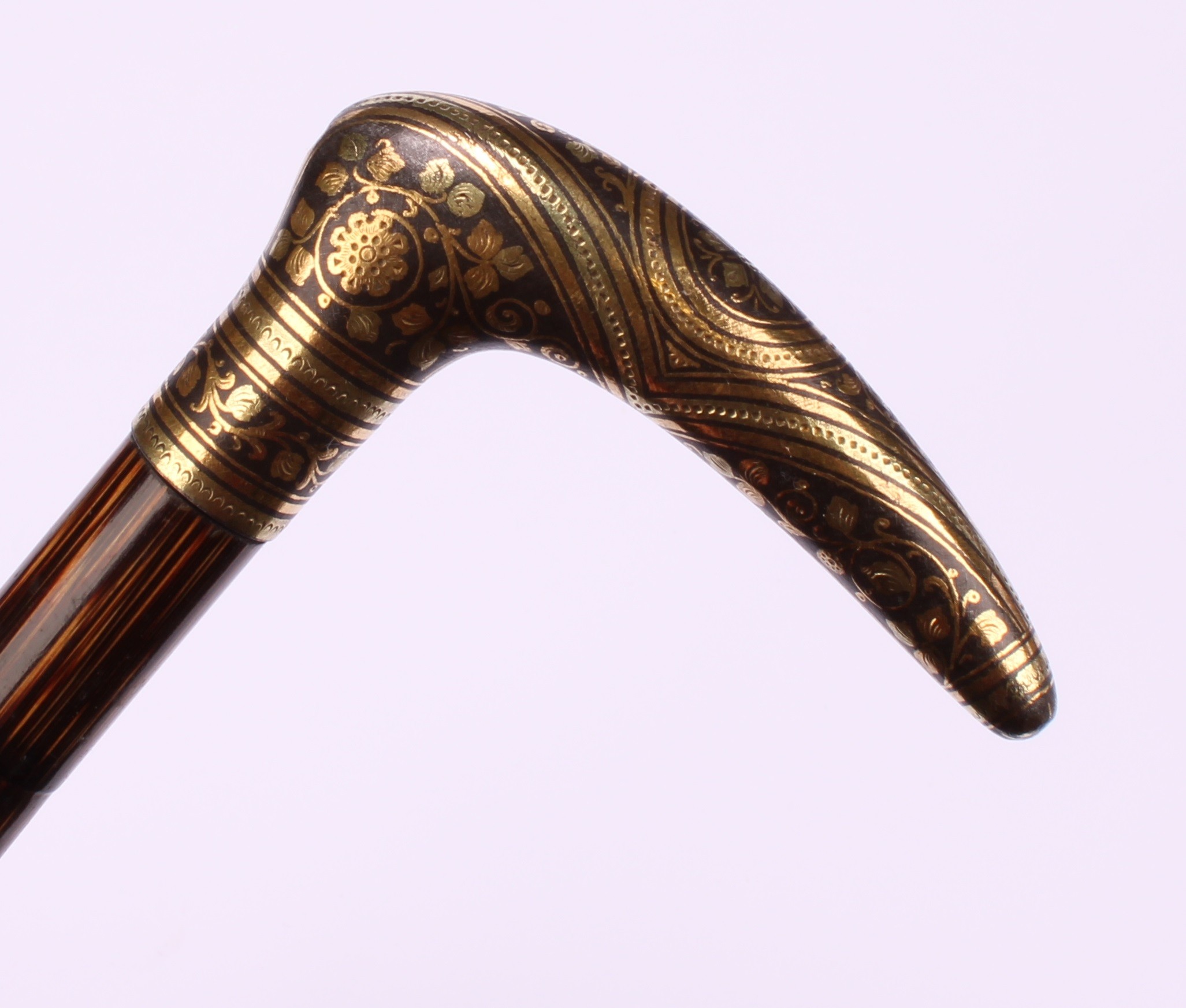An early 20th century Toledo gold damascened steel parasol handle, eight tips ensuite, 11cm wide, - Image 6 of 6