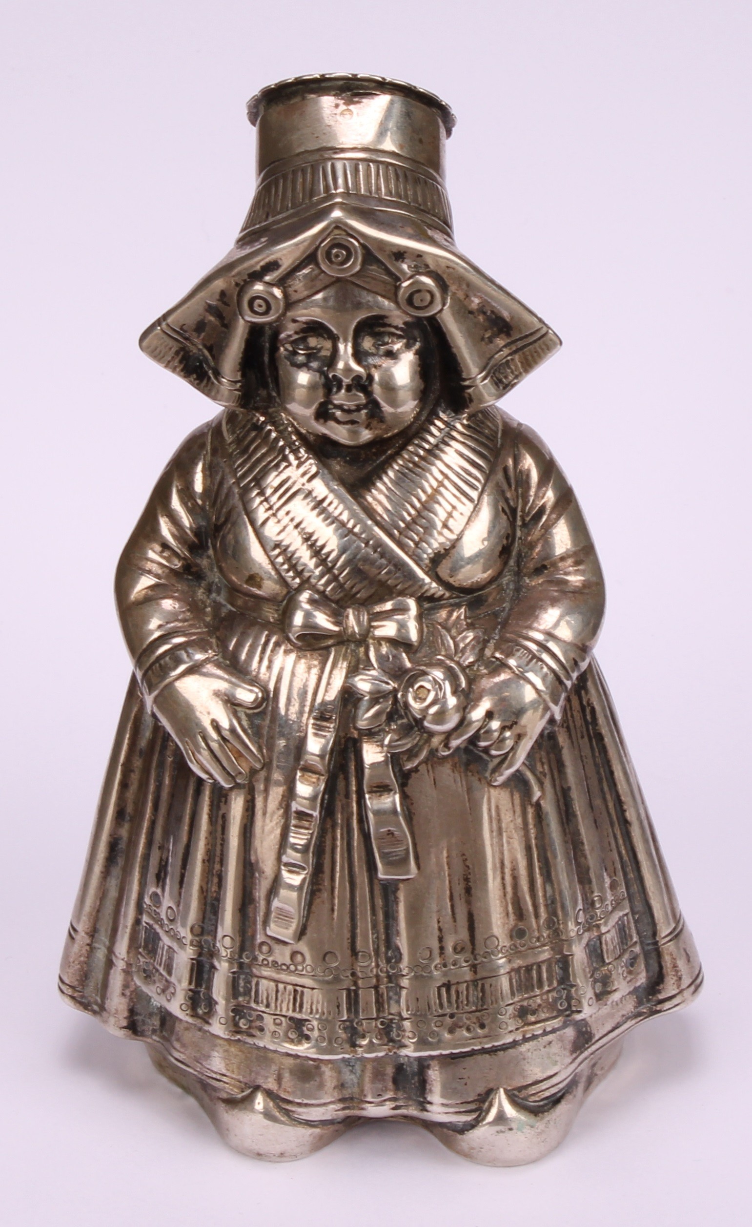 A large German silver novelty pepper, as a young Dutch girl traditionally dressed, 13cm high, - Image 2 of 5