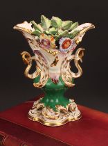 A Coalport Rococo Revival pedestal vase, painted with butterflies and flowers in shaped reserves
