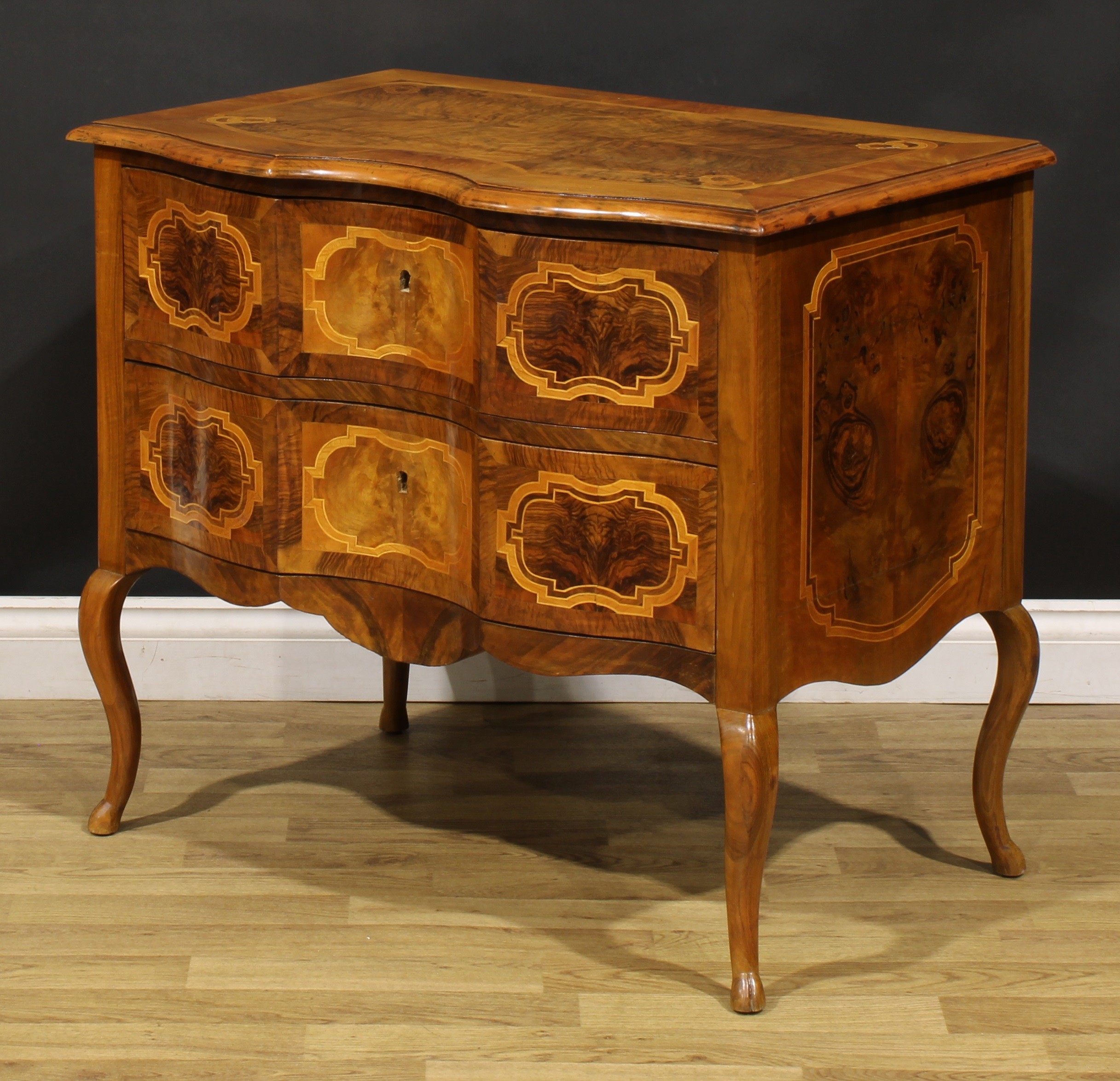 An 18th century style Italian walnut serpentine commode, oversailing top above a pair of long - Image 5 of 6