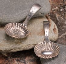 A George III silver caddy spoon, fluted circular bowl, bright-cut and wrigglework engraved stem, 7cm