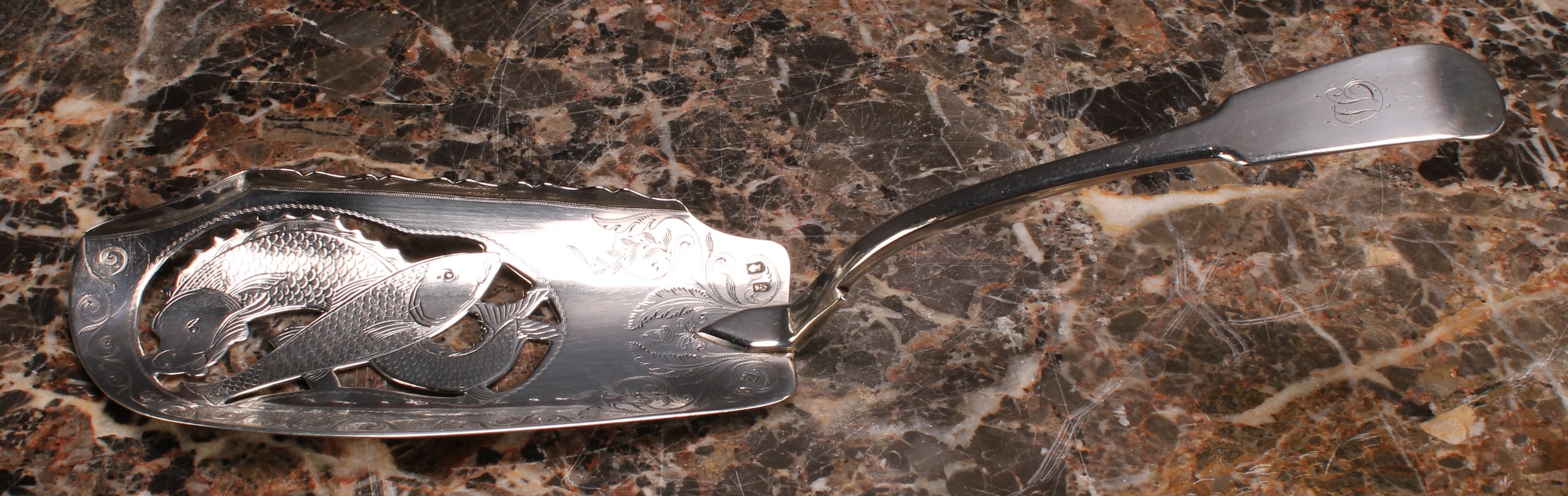 A George III Irish silver Fiddle pattern fish slice, pierced and bright-cut engraved with fish and - Image 2 of 3