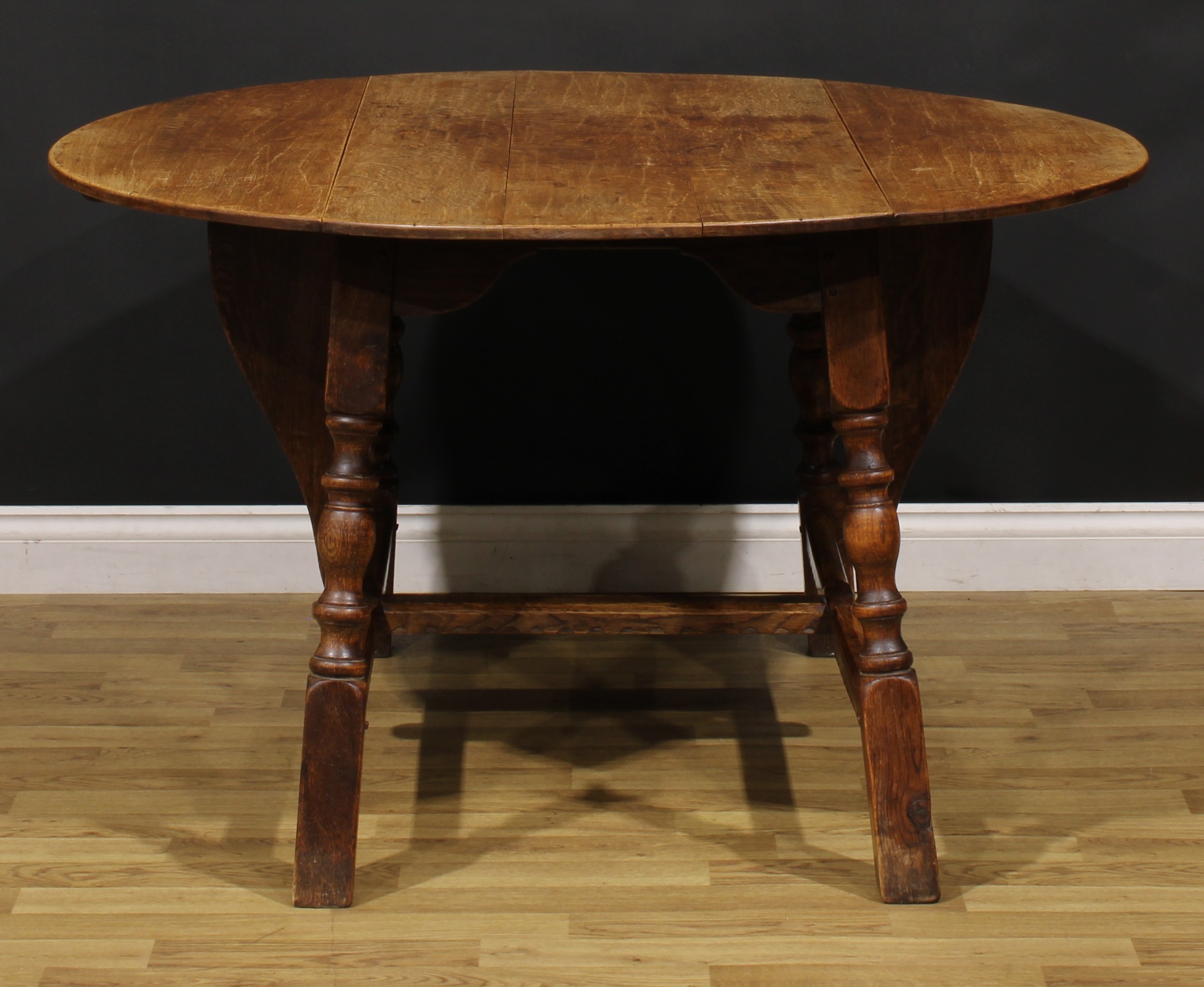 An oak dropleaf dining table, by Rupert/Nigel Griffiths Monastic Woodcraft, 74cm high, 60.5cm - Image 2 of 4