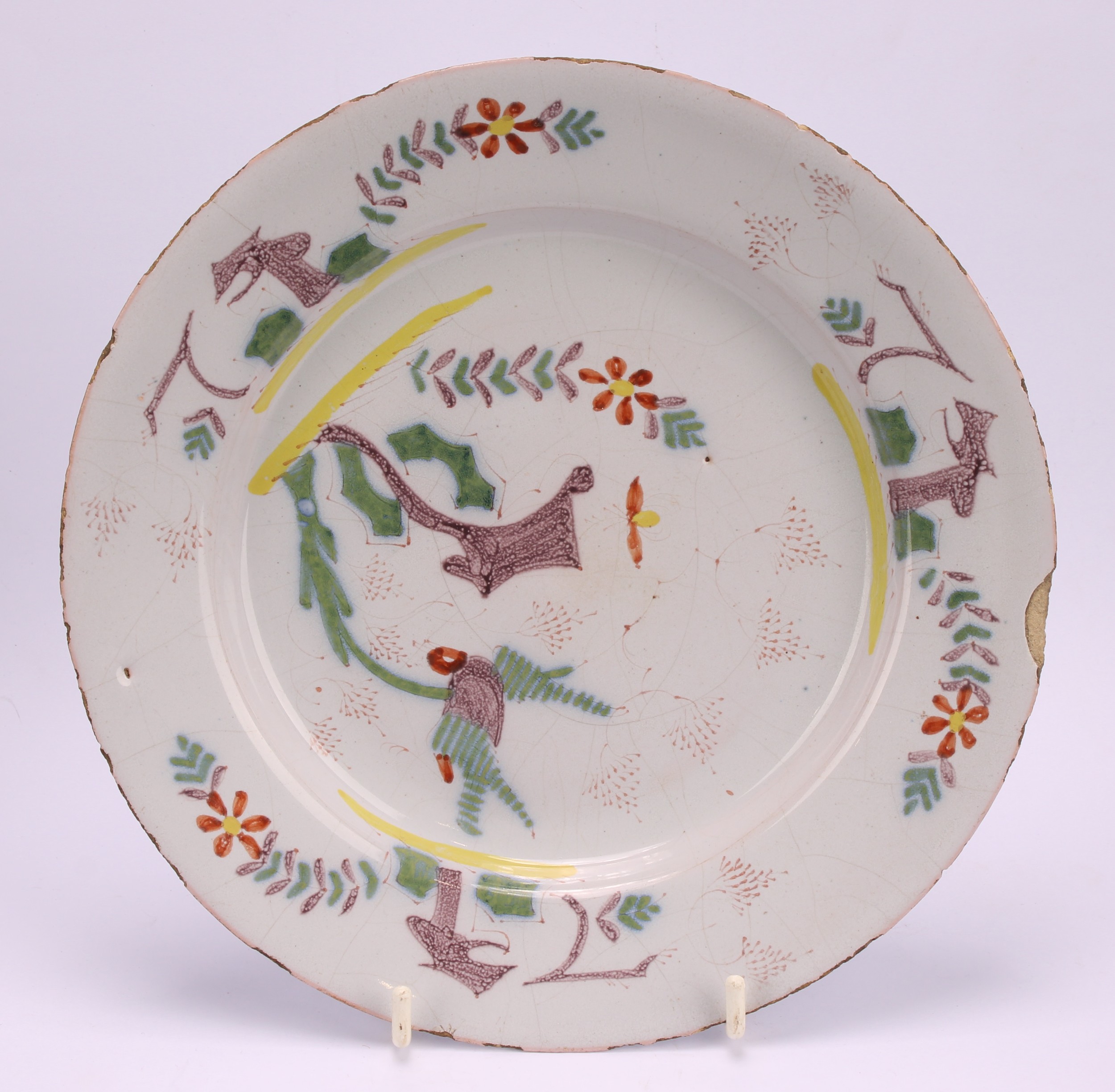 An 18th century Delft circular plate, painted in the chinoiserie taste with a figure in a Chinese - Image 4 of 18
