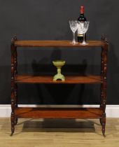 A George IV mahogany rectangular three tier whatnot, turned finials and supports, brass casters,