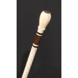 A 19th century sailor's maritime whale bone walking cane, octagonal pommel set with a coin, the