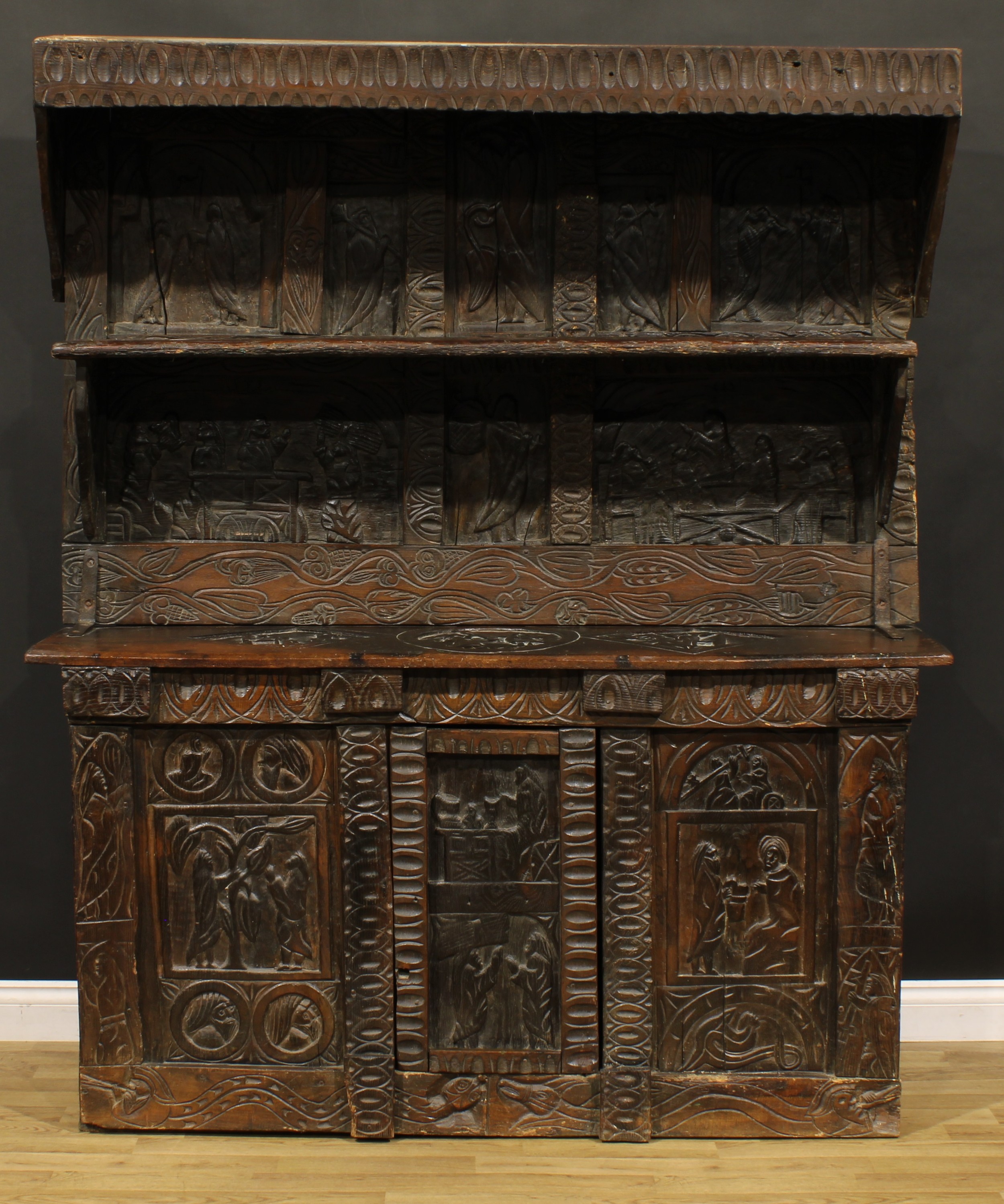A 17th century style ecclesiastical Historicist Revival oak dresser or side cabinet, carved - Image 2 of 4