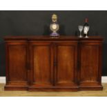 A Post-Regency mahogany break-centre low enclosed library bookcase or side cabinet, oversailing