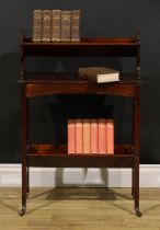 An Edwardian mahogany two-tier book trough, ceramic casters, 86cm high, 57cm wide, 23cm deep, c.1905