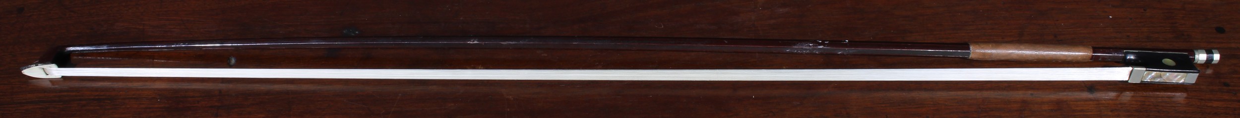 A violin bow, stamped tourte, 73cm long