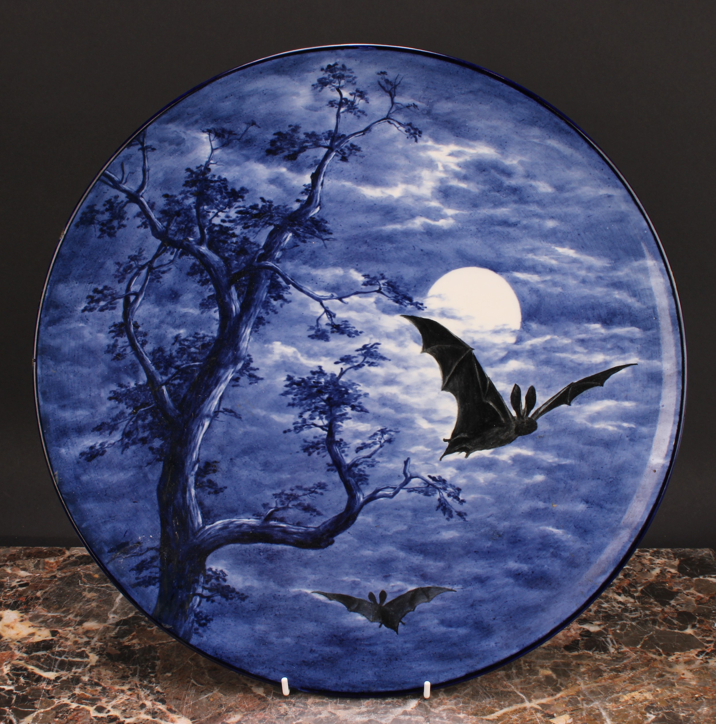 A Royal Worcester Aesthetic Movement circular charger, painted with bats against a moonlit sky, in - Image 2 of 4