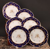 A set of six Royal Crown Derby shaped circular plates, each decorated with a pedestal urn draped