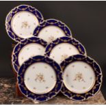 A set of six Royal Crown Derby shaped circular plates, each decorated with a pedestal urn draped