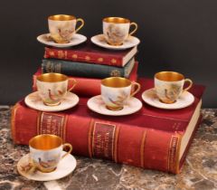 A set of six Royal Worcester coffee cups and saucers, painted by James Stinton, signed, with