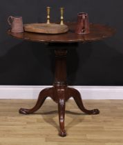 A 19th century mahogany tripod occasional table, pie-crust top, reeded spreading cylindrical column,