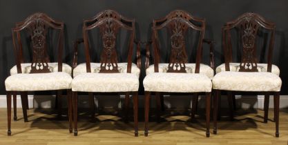 A set of eight Hepplewhite Revival mahogany dining chairs, comprising six side chairs and a pair