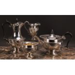 A George V Regency style silver four piece tea service, comprising tea pot, coffee pot, milk jug and