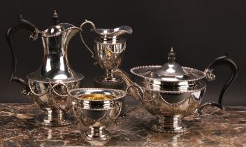 A George V Regency style silver four piece tea service, comprising tea pot, coffee pot, milk jug and