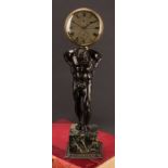 A a dark patinated bronze figural clock, Atlas, Arnold & Dent, 84, Strand London, marble cube base