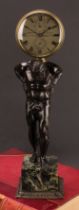 A a dark patinated bronze figural clock, Atlas, Arnold & Dent, 84, Strand London, marble cube base