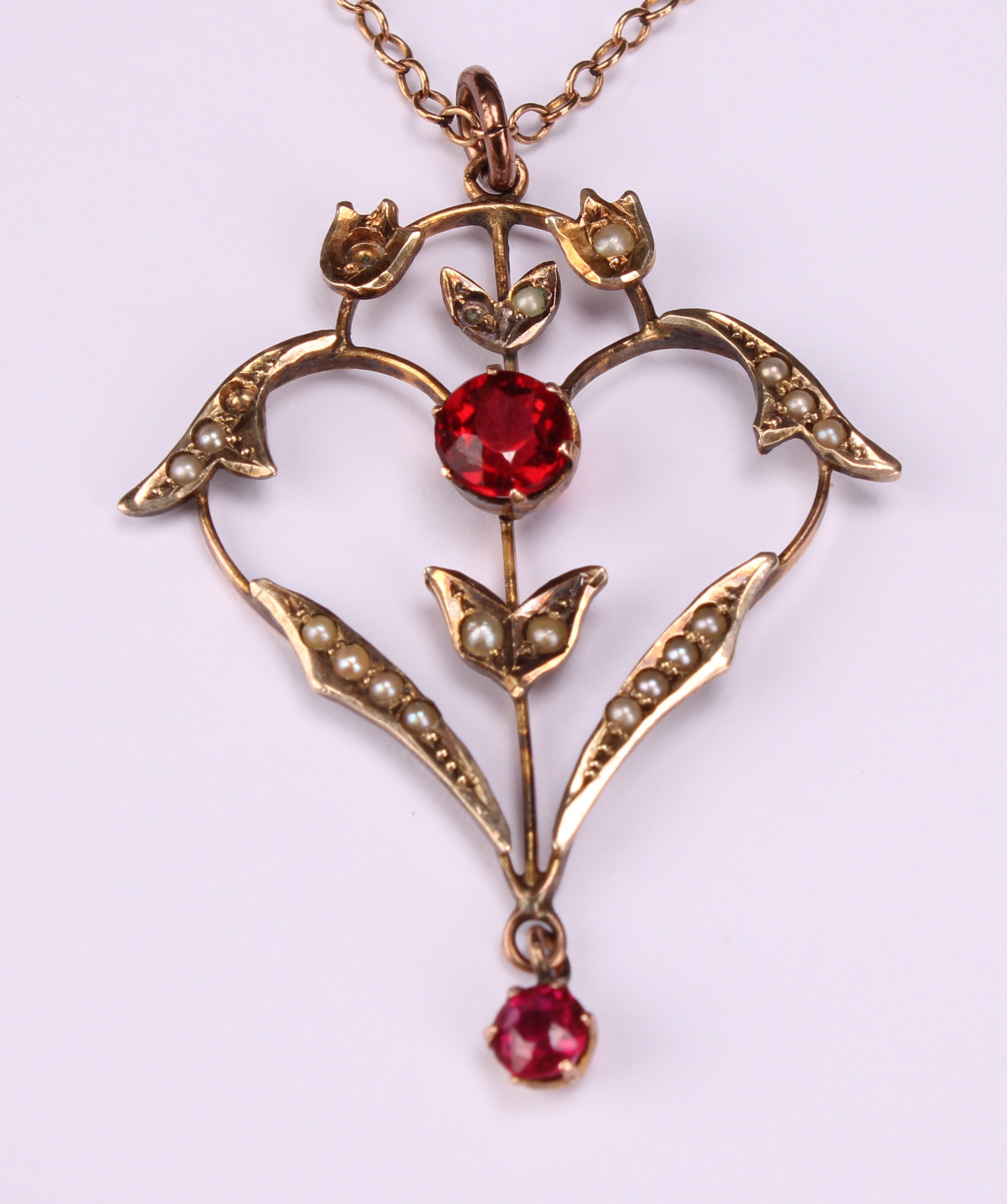 An Art Nouveau amethyst and split pearl scrolling heart pendant necklace, 9ct gold mount and - Image 3 of 4
