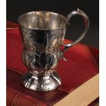 A Victorian Gothic Revival silver ogee mug, scroll handle, domed foot, 13cm high, Hilliard &