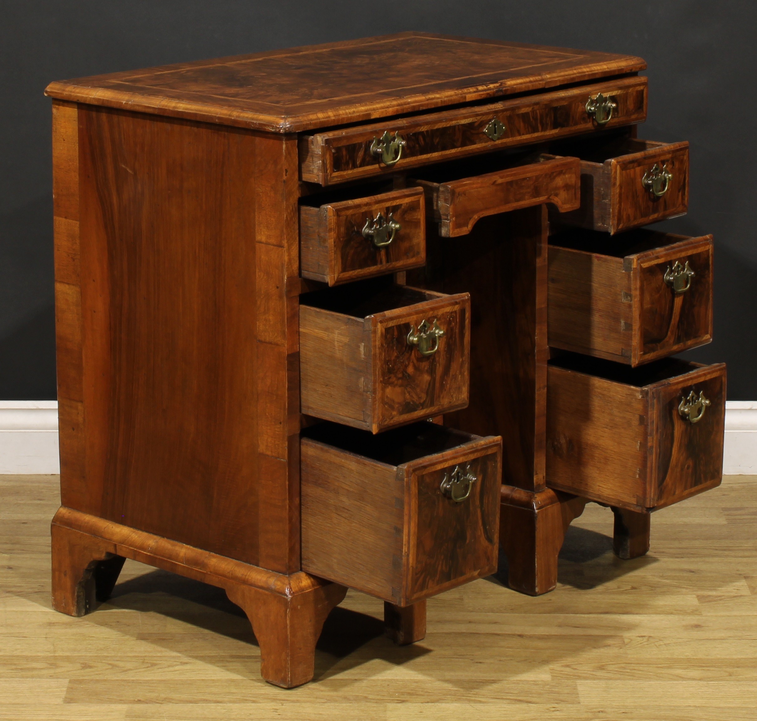 A George II featherbanded walnut kneehole desk, rectangular top with moulded edge above an - Image 4 of 6