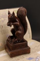 Manner of Henry Leach (1809-1885), a contemporary composite simulated oak model, of a squirrel, in