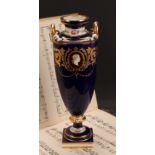 A Minton two-handled pedestal vase, painted with neo-classical portraits in raised gilt oval panels,