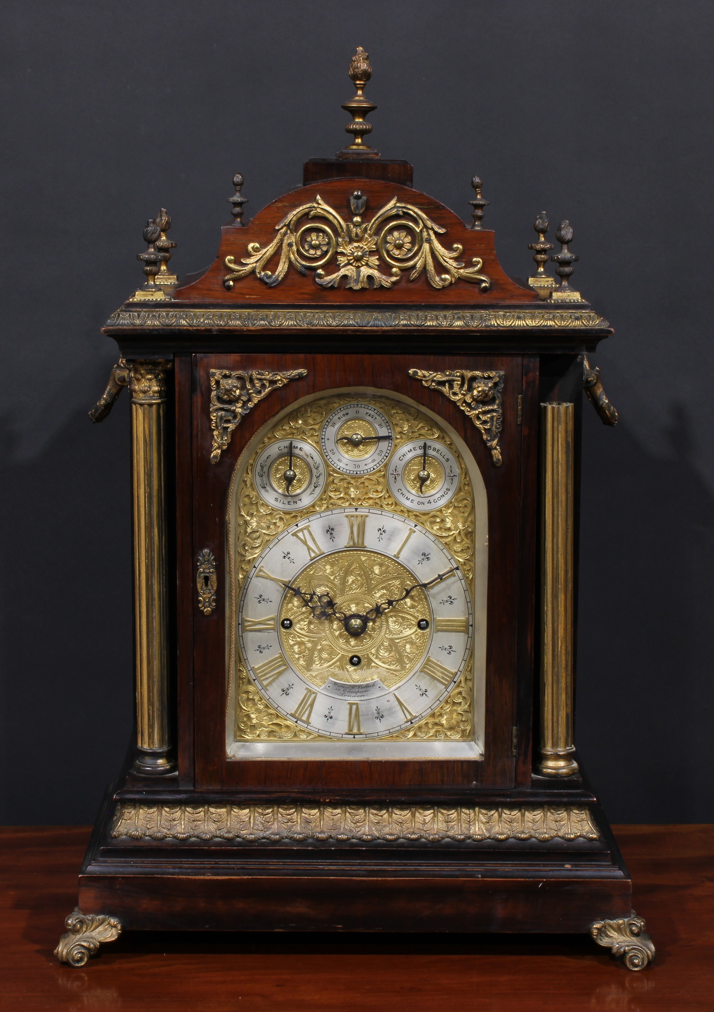 A substantial Victorian gilt metal mounted rosewood musical bracket clock, in the George II taste,