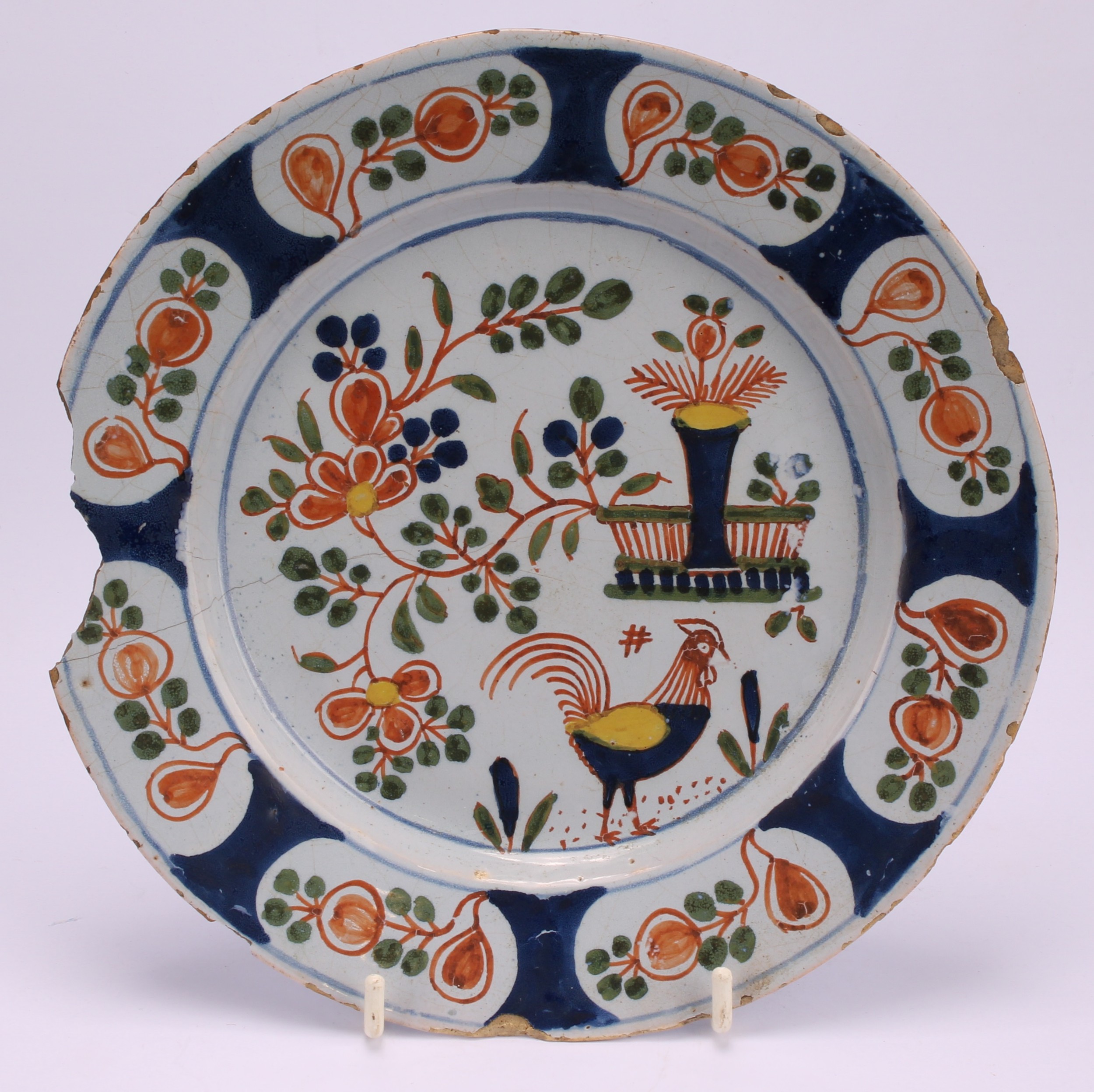 An 18th century Delft circular plate, painted in the chinoiserie taste with a figure in a Chinese - Image 14 of 18