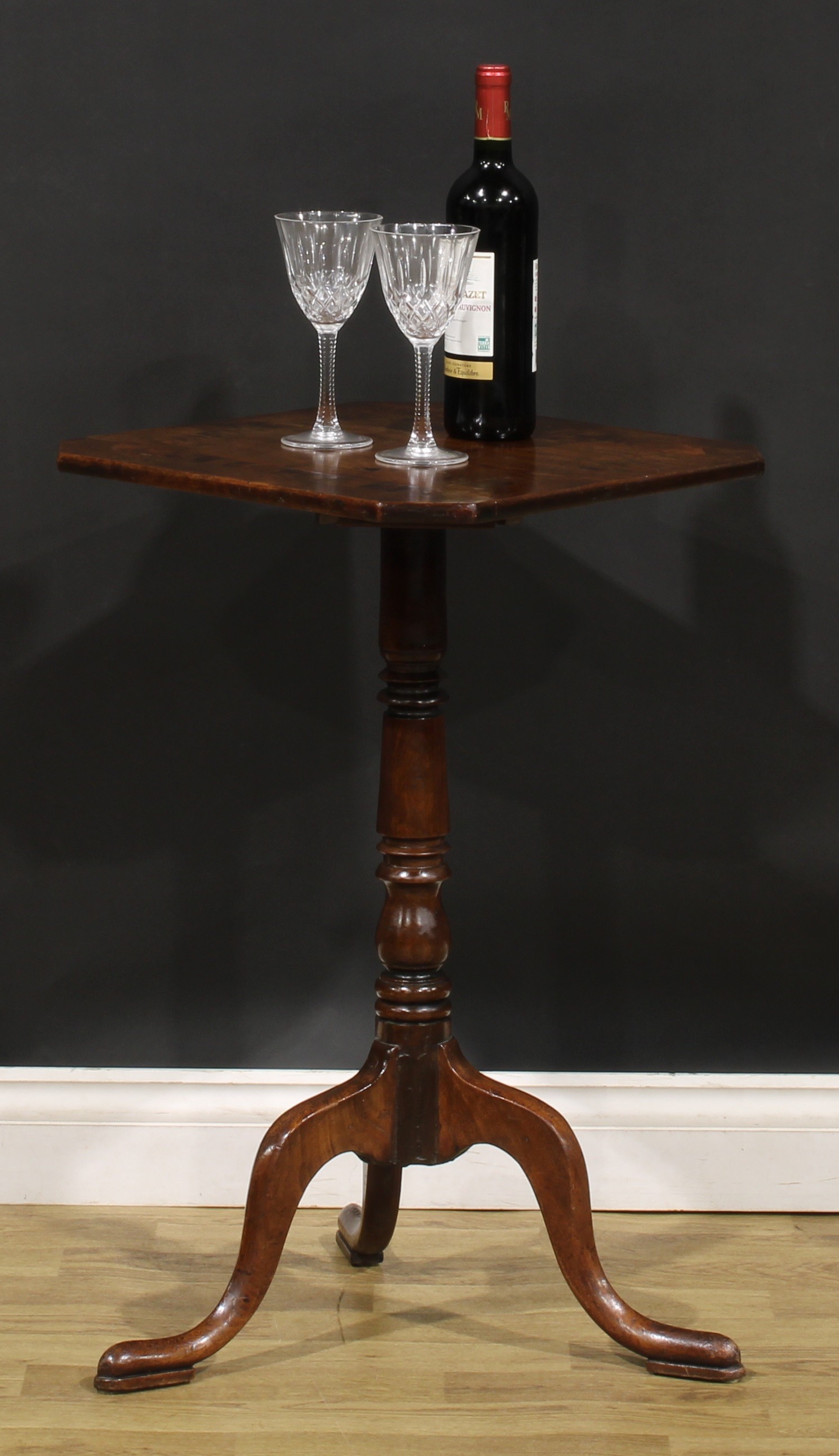 A George III mahogany tripod wine table, canted square top inlaid with a broad rosewood band, 73.5cm