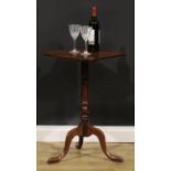 A George III mahogany tripod wine table, canted square top inlaid with a broad rosewood band, 73.5cm