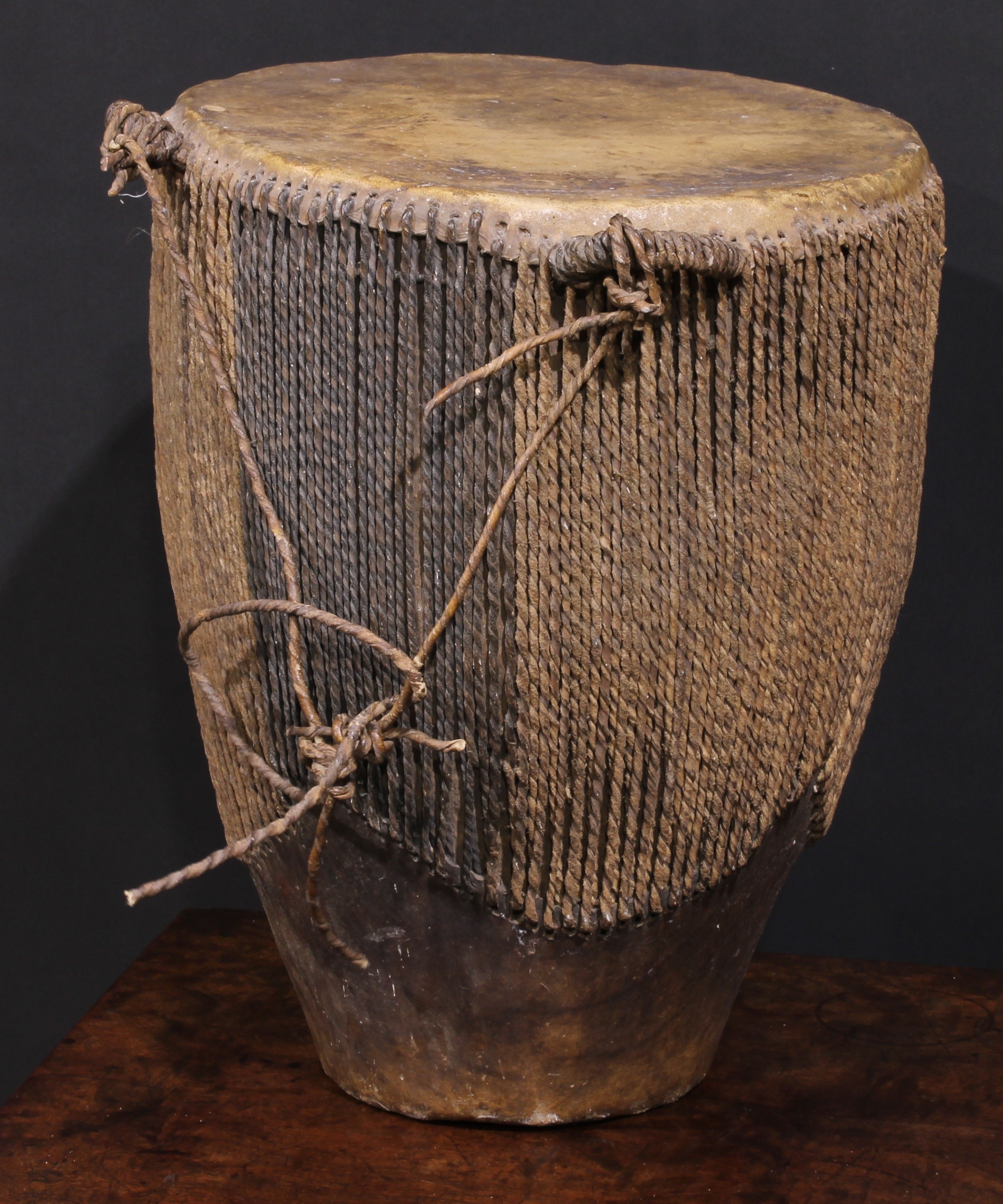 A Ugandan embuutu drum, hide bound hard wood, twin suspension loops, 39cm high, late 19th/early 20th - Image 3 of 3