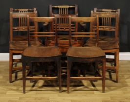 A harlequin set of eight early 19th century oak and deciduous timber dining chairs, the armchair
