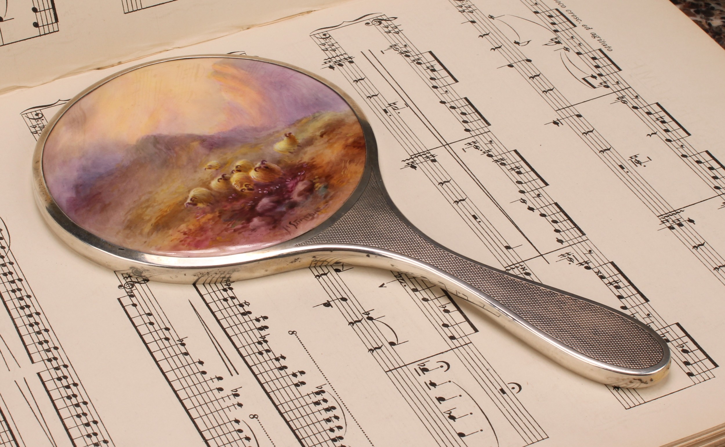 A Royal Worcester mounted silver hand mirror, the plaque painted by Harry Stinton, signed, with