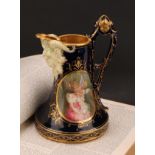 A Vienna porcelain jug, the central oval cartouche painted with Cupid and Psyche, Bacchic mask spot,