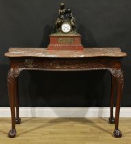 A George II Revival mahogany serpentine serving table, oversailing marble top above a blind fretwork