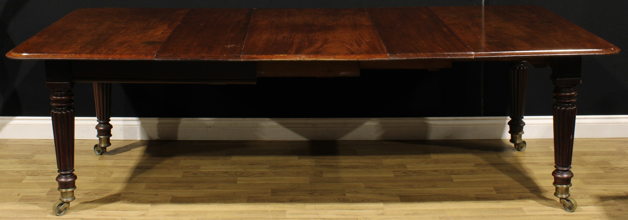 A 19th century mahogany extending dining table, in the manner of Gillows of Lancaster and London, - Image 2 of 3