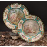 A pair of Sevres shaped circular plates, painted by L Vergniaud, signed, with a courting couple in a