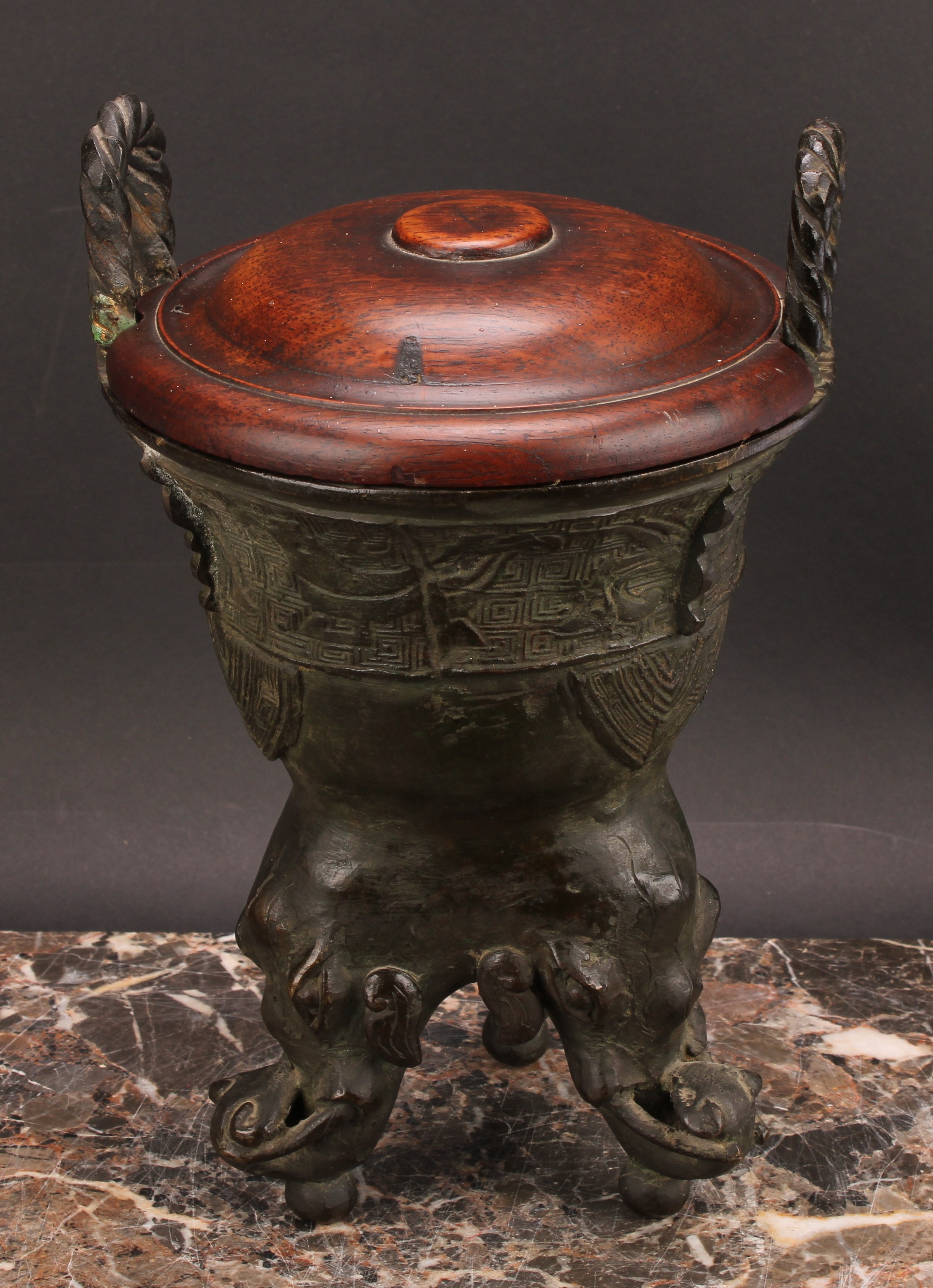 A Chinese patinated bronze ding censer, cast in the archaic manner, twist handles, outswept rim, - Image 2 of 5
