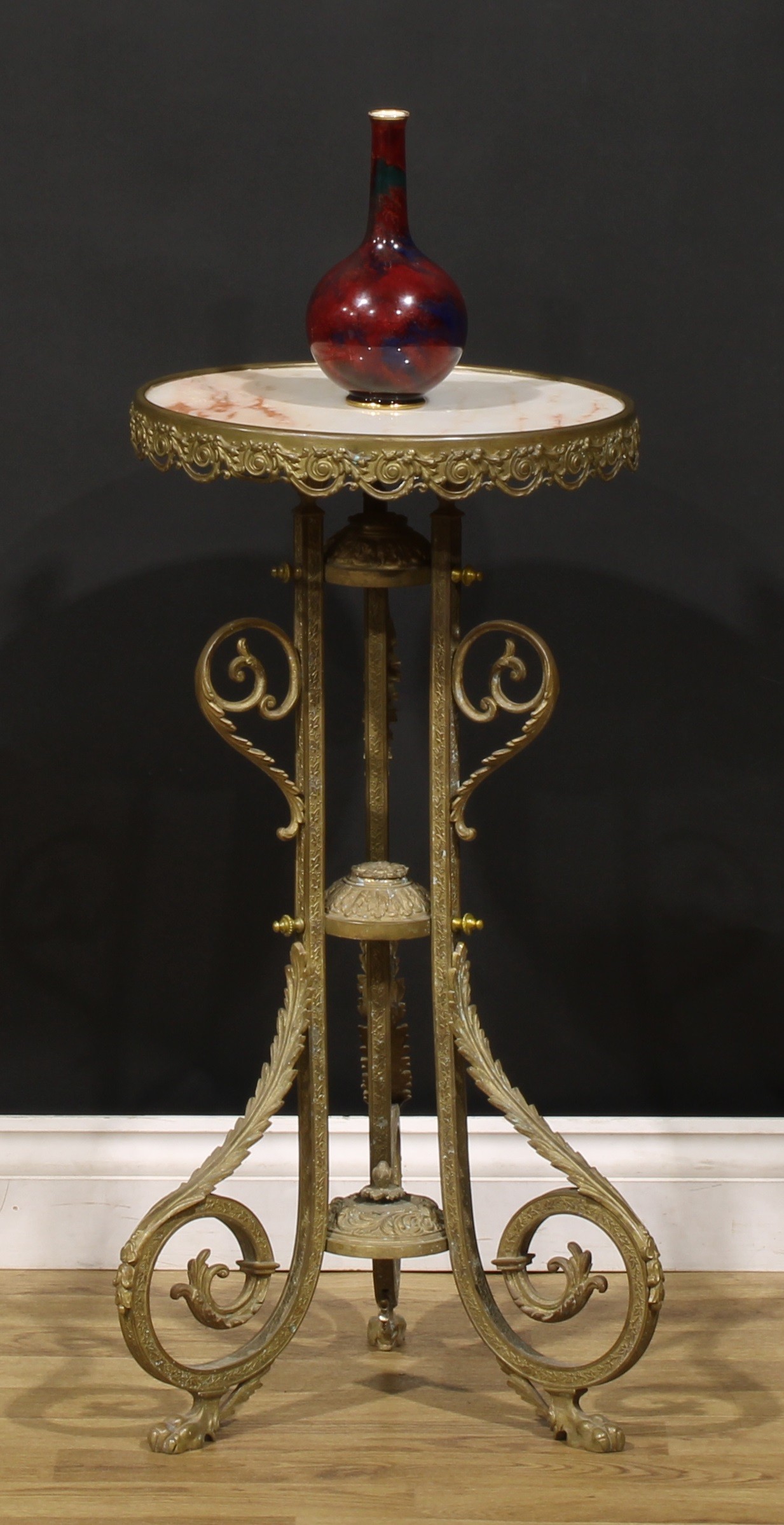 An early 20th century French brass and onyx tripod guéridon or plant stand, circular top, the