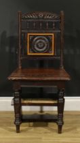 A late Victorian Aesthetic Movement metamorphic library step chair, spindle back with carved central