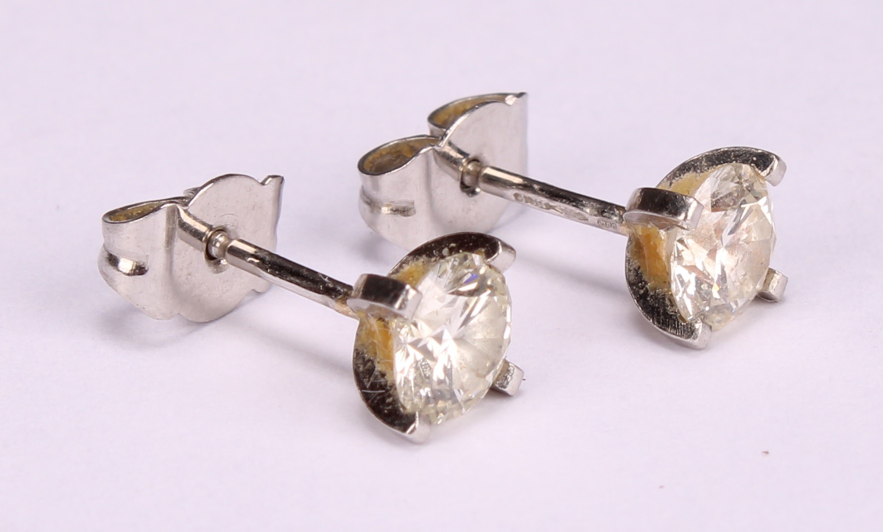 A pair of diamond stud earrings, the round brilliant cut stones claw set, platinum mounted, 1.7ct - Image 3 of 5