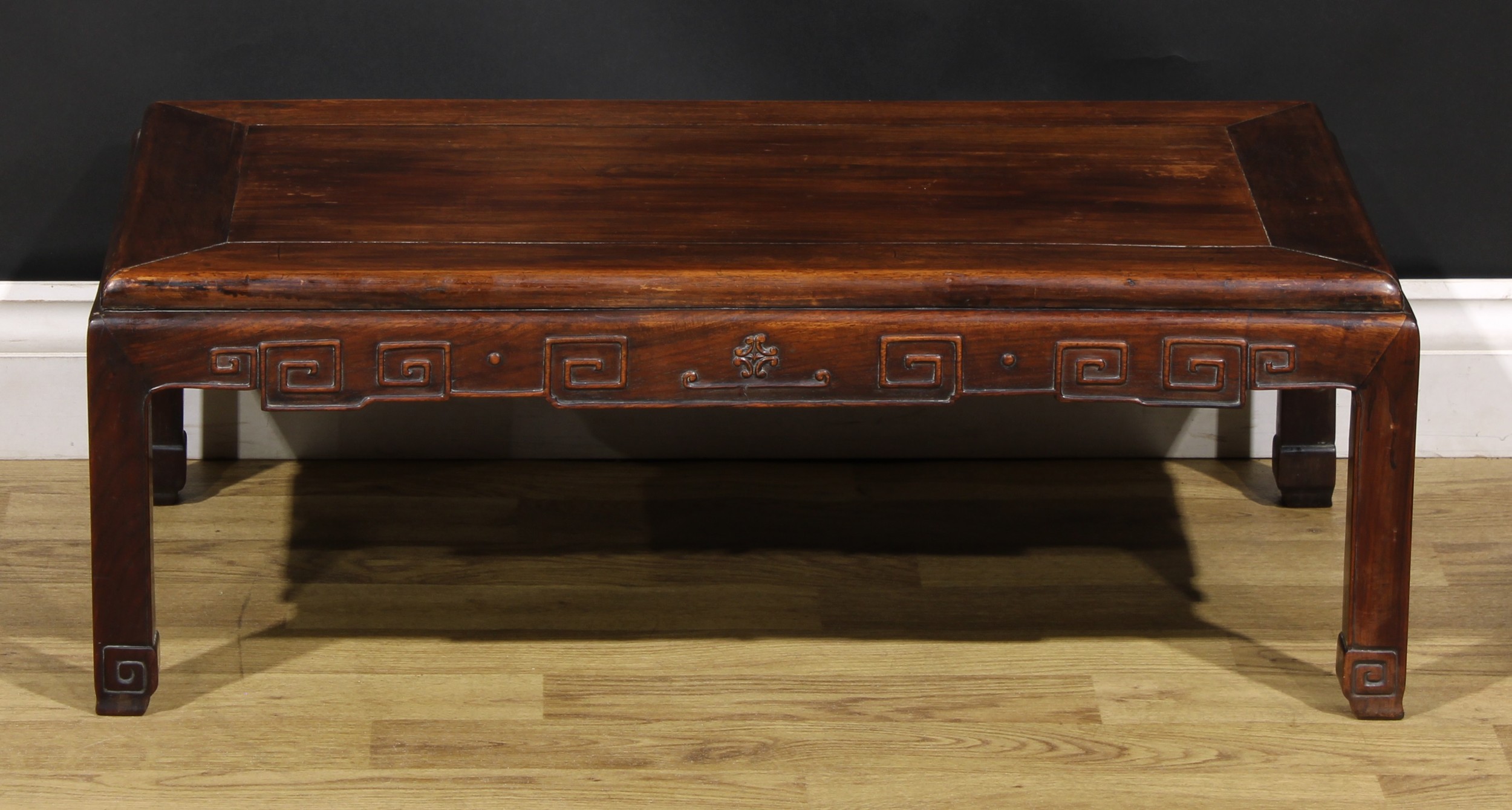 A Chinese hardwood low tea table, panel top, shaped apron carved with angular stylised clouds, - Image 5 of 5