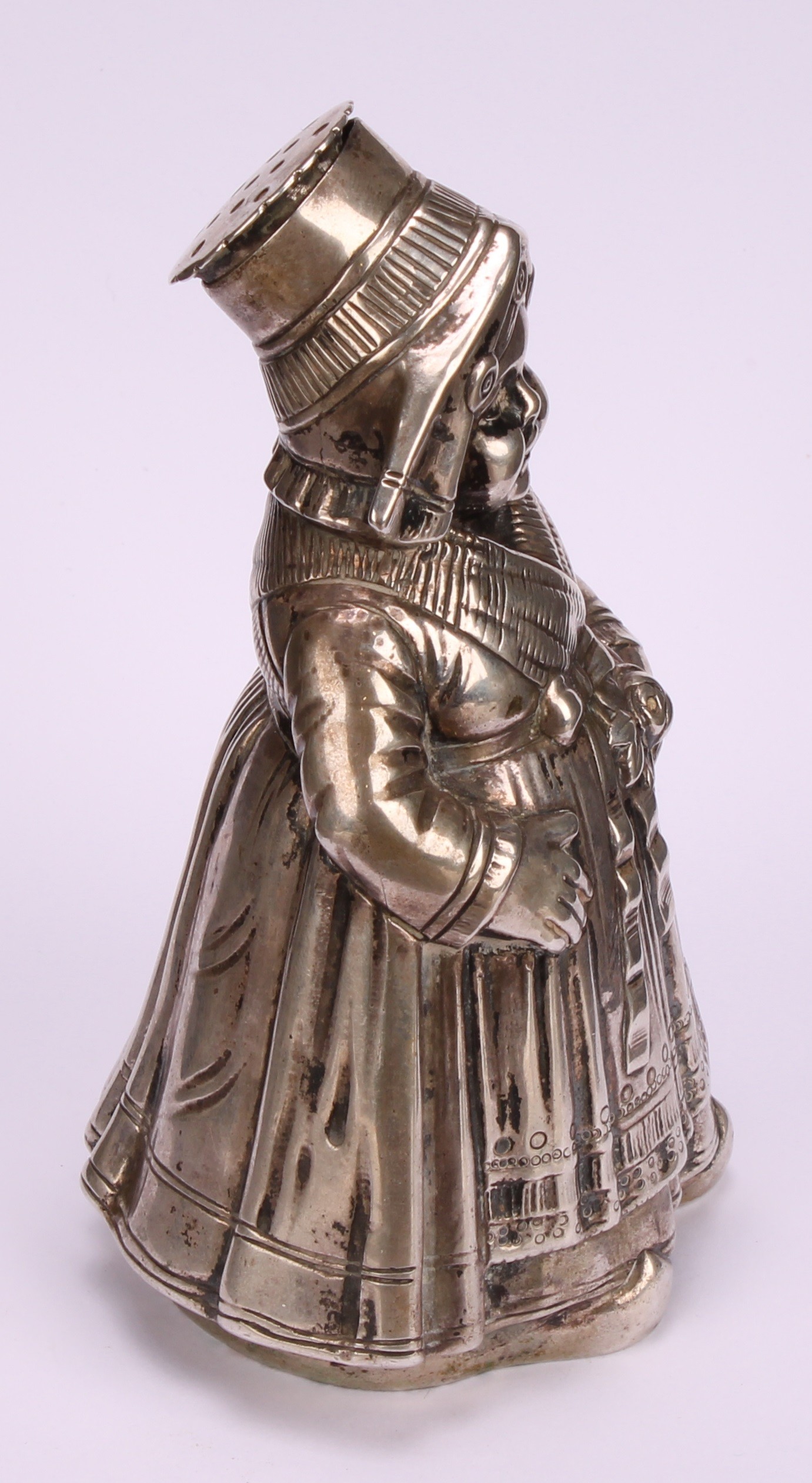 A large German silver novelty pepper, as a young Dutch girl traditionally dressed, 13cm high, - Image 3 of 5