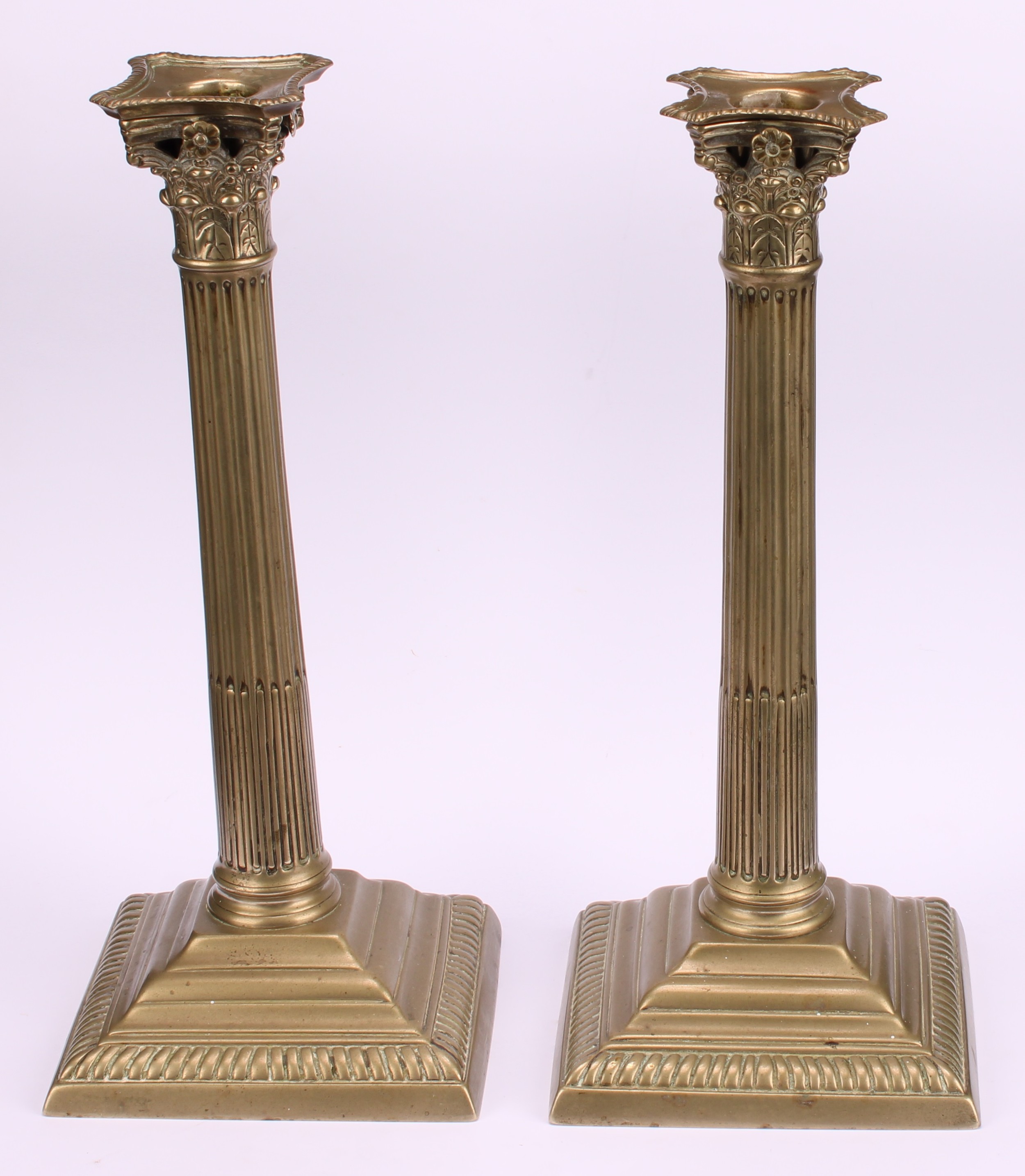 A pair of George III base metal stop-fluted Corinthian column candlesticks, stepped square bases, - Image 2 of 3