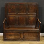 An 18th century oak box settle, rectangular panel back, hinged seat, 147cm high, 140cm wide, the